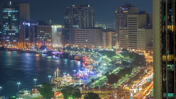 Dubai Creek Landscape Night Timelapse with Boats and Ship Near Waterfront alt