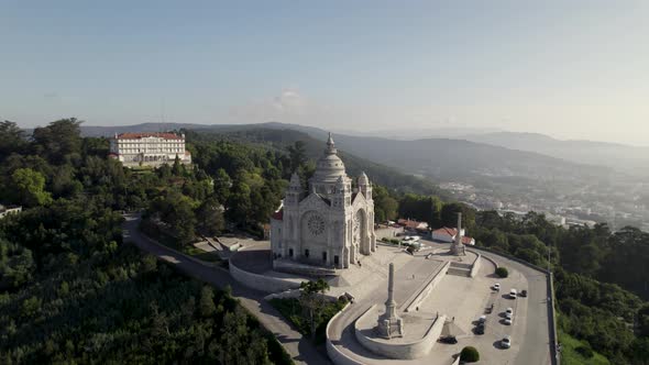 Grandiose Catholic church on mountaintop, Viana do Castelo, Portugal; drone alt