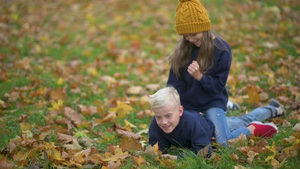 Happy Children Having Fun in the Autumn Park.