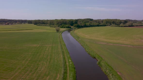 River Berkel in the Achterhoek flows through agricultural area, Gelderland, the Netherlands alt