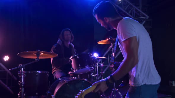 Musicians performing during a concert alt