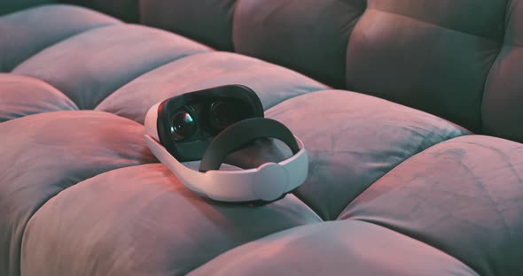 Close up virtual reality goggles on a couch alt