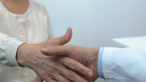 Patient and Doctor Handshake Close-Up, Consultation in Clinic, Health Care