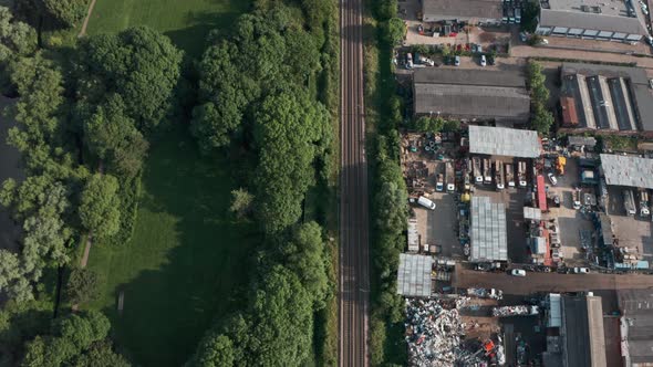 Pan up drone shot of long empty National rail train tracks Cheshunt north London alt