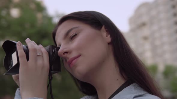 Woman Professional Photographer with Camera Photo Shooting Close Up Face