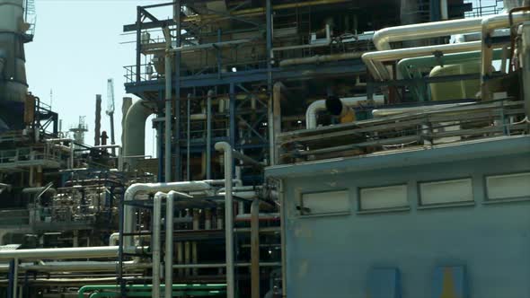 Driving by an industrial oil gasoline production refinery. alt