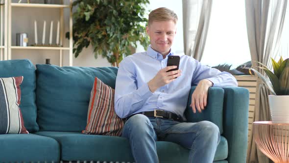 Middle Aged Man Browsing on Smartphone Searching alt