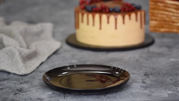 Piece of Layer Caramel Cake with Cream and Fresh Berries
