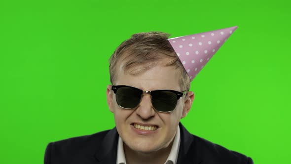 Drunk Businessman in Festive Cap, Sunglasses Drink Alcohol. Hangover. Chroma Key alt