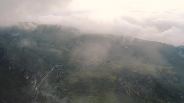 Drone shot of Canyon del Colca with clouds in Peru 4K