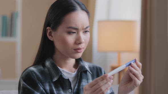 Puzzled Doubtful Asian Woman Waiting Result of Pregnancy Test Girl Worry with Unplanned Children alt