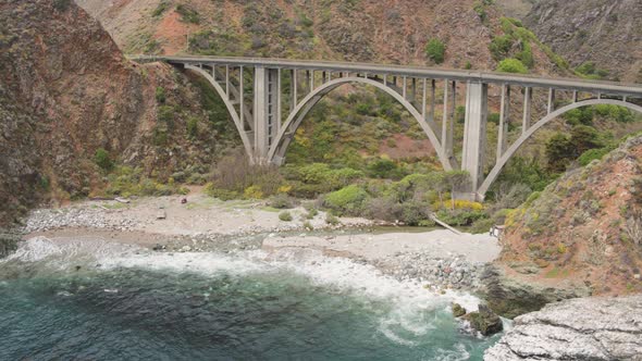 Aerial Drone Shot of a Bridge on a Rocky, Steep Coastline Road (Big Sur, Pacific Coast Highway, CA)