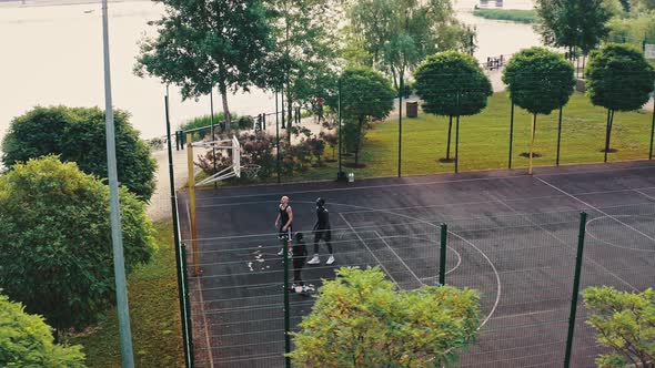 Nice Top View of the City Basketball Court Surrounded By Trees alt