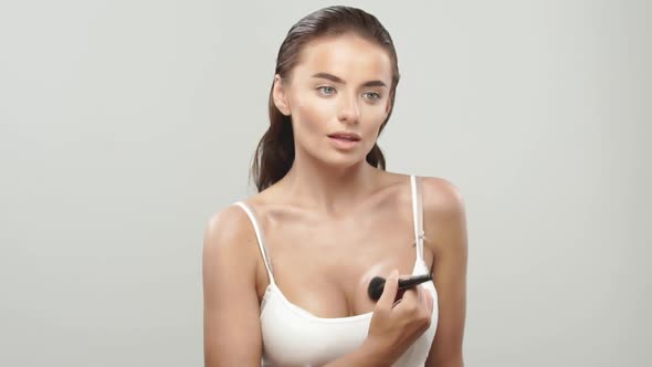 Pretty Woman Doing Makeup for Her Boobs alt