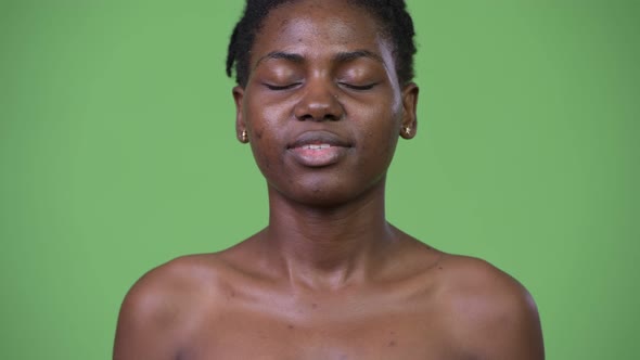 Young Beautiful African Woman Relaxing with Eyes Closed Shirtless