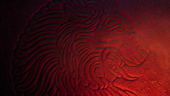 Lion Stone Carving Lit Up With Dust Swirling alt