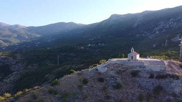 Panorama of Ancientt Church Located on Rock in Sunny Rays