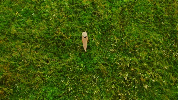 Aerial View on Female Goes Outdoors alt