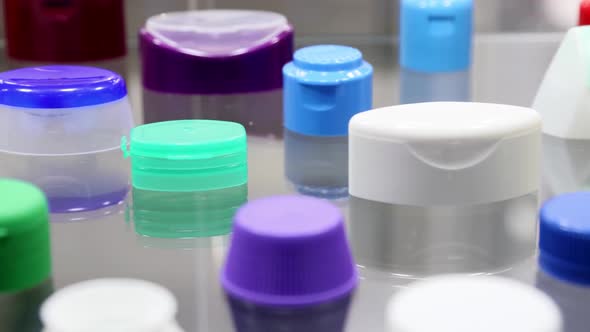 Plastic Lids of Different Shapes and Purposes in Different Colors