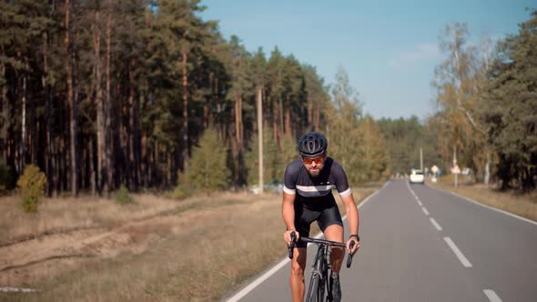 Triathlete Cyclist Training On Bicycle. Sport Recreation Workout. Fit Athlete Sport Workout. alt