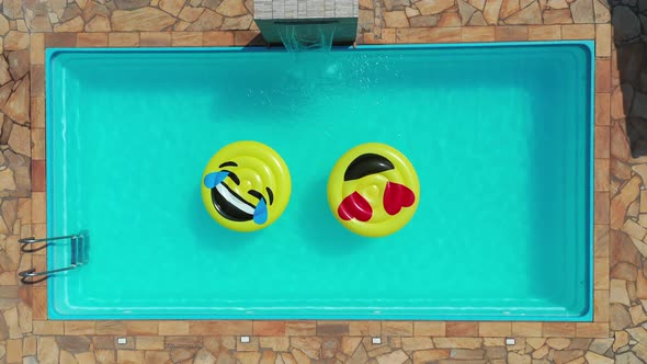 Float smile emoji emoticon icon buoy at swimming pool at countryside alt