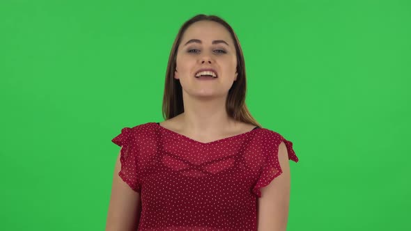 Portrait of Girl Is Pointing Side Hand for Something Then Shows Thumb Like, Then Other Side and alt