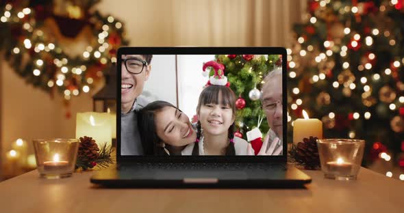 Merry Xmas eve festive virtual wishing online message laptop screen. alt