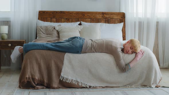Exhausted Unhappy Woman Sleeping on Bed at Home or Hotel Exhausted After Working Too Much alt