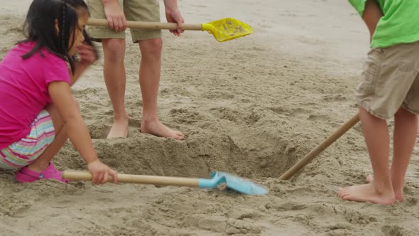 Children playing at beach. Shot on RED EPIC for high quality 4K, UHD, Ultra HD resolution. alt