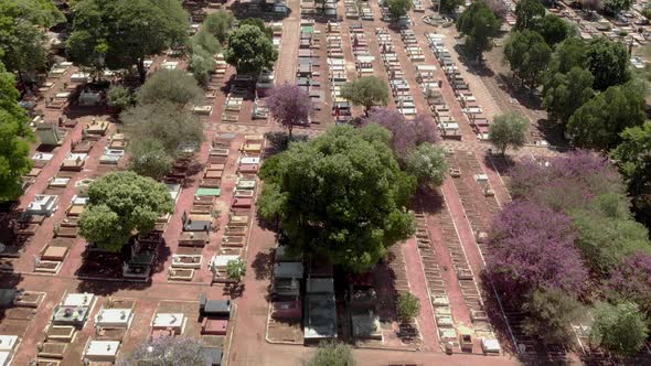 Scenic aerial flight directly above densely packed cemetery graveyard alt
