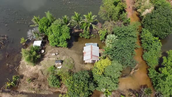 Houses And Farm Field Surrounded With Floodwaters In Battambang, Cambodia - Aerial Top View alt