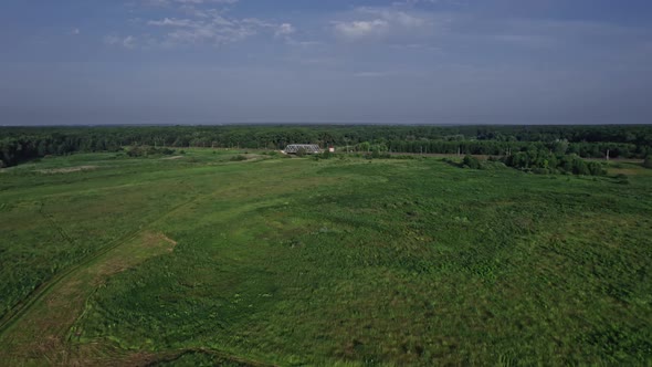 Railway Bridge Among Green Meadows Over a Small River in the Countryside alt