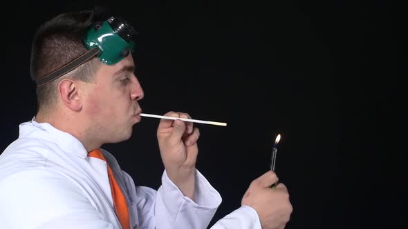 Chemist Breathes Fire Through a Straw, Slow Motion alt