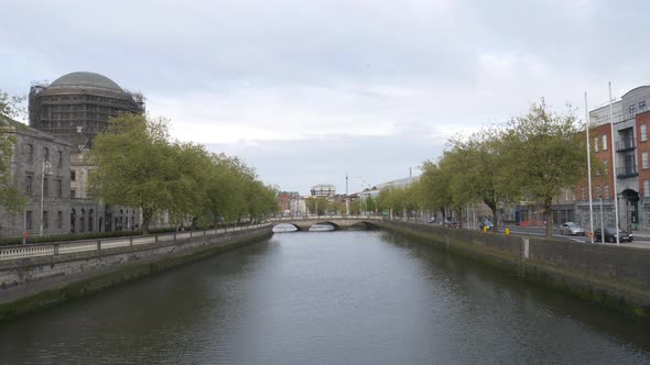 Calm Water Of Liffey River In City Centre Of Dublin In Ireland. - wide shot alt