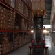 Forklift Driver Lifting Pallet of Boxes at Height - VideoHive Item for Sale