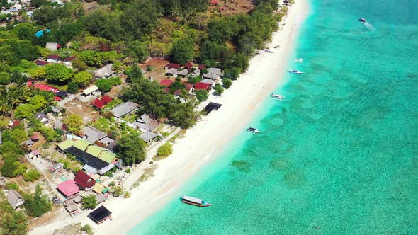 Wide angle flying copy space shot of a paradise sunny white sand beach and aqua turquoise water alt