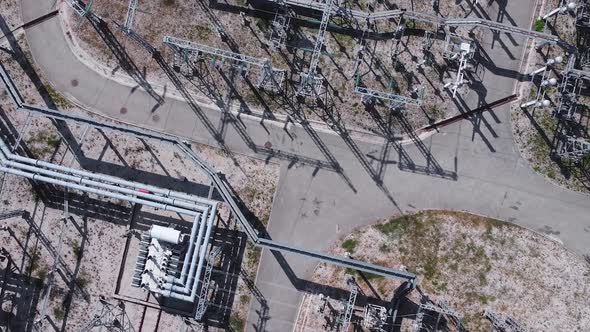 Aerial view of electrical power transformer in high voltage substation.