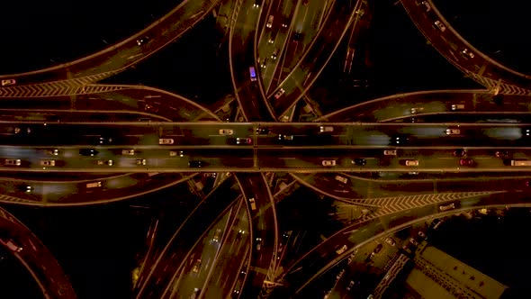 Aerial view of vehicles driving a traffic intersection, Shanghai, China. alt