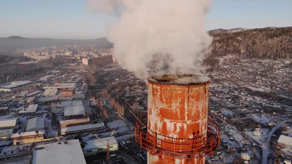 Smoke Comes From the Chimney Against the Background of the City Buildings Gardens alt