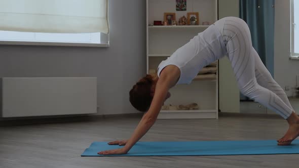 Young Woman Practicing Yoga in Studio alt