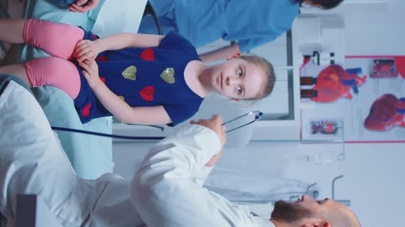 Vertical Video: Little Girl Having Medical Check Up alt