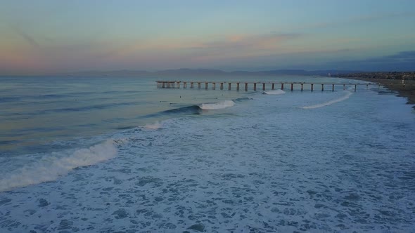 Aerial drone uav view of a pier, beach and ocean. alt