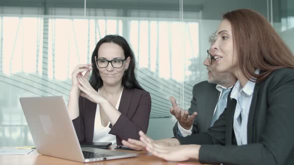 Content Businesswoman Explaining Project and Gesturing alt