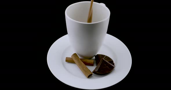Cup with chocolate on a turntable. Mexican drink. alt