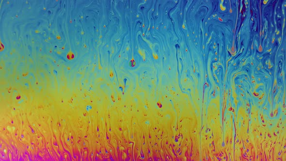 Macro soap bubble creates a colorful and psychedelic background alt