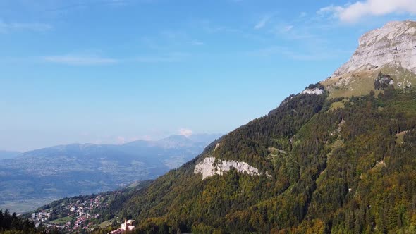 Aerial tilt down view over Passy, in the french Alps, on a warm fall season day. Haute Savoie. alt