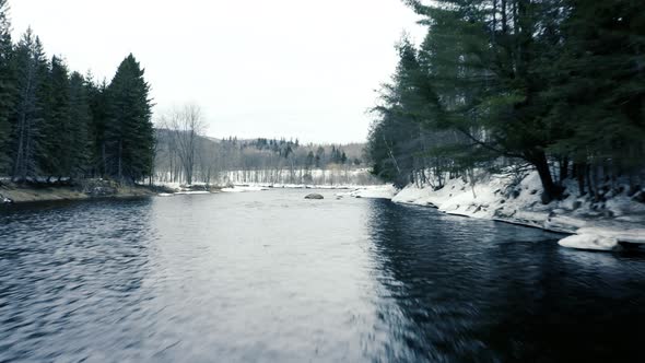 Winter Landscape - Drone Flying forwards over river fast - 4K - sequence 002/002 alt