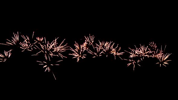 Shimmering fireworks spreading in the sky in celebration night