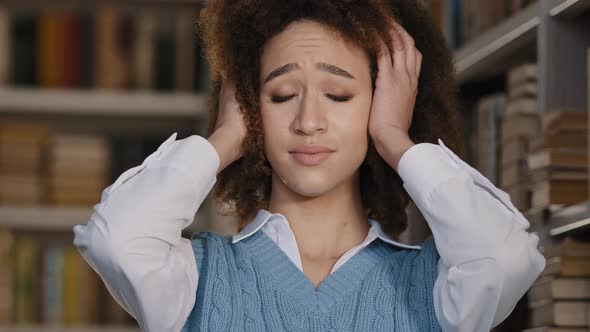 Closeup Sad Frustrated Young Woman Suffering From Loud Sound Covering Ears with Hands Holding Head alt