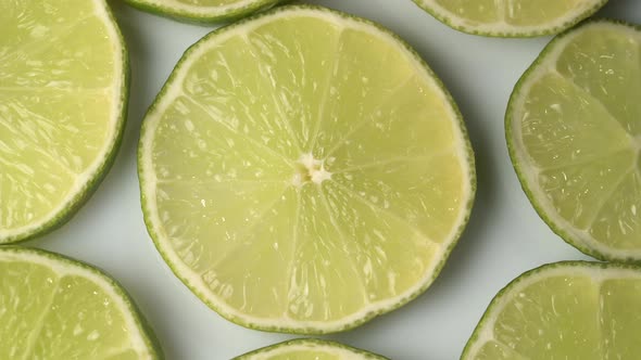 Lime Slices Closeup, Macro Food Summer Background, Fruits Top View. Rotate alt